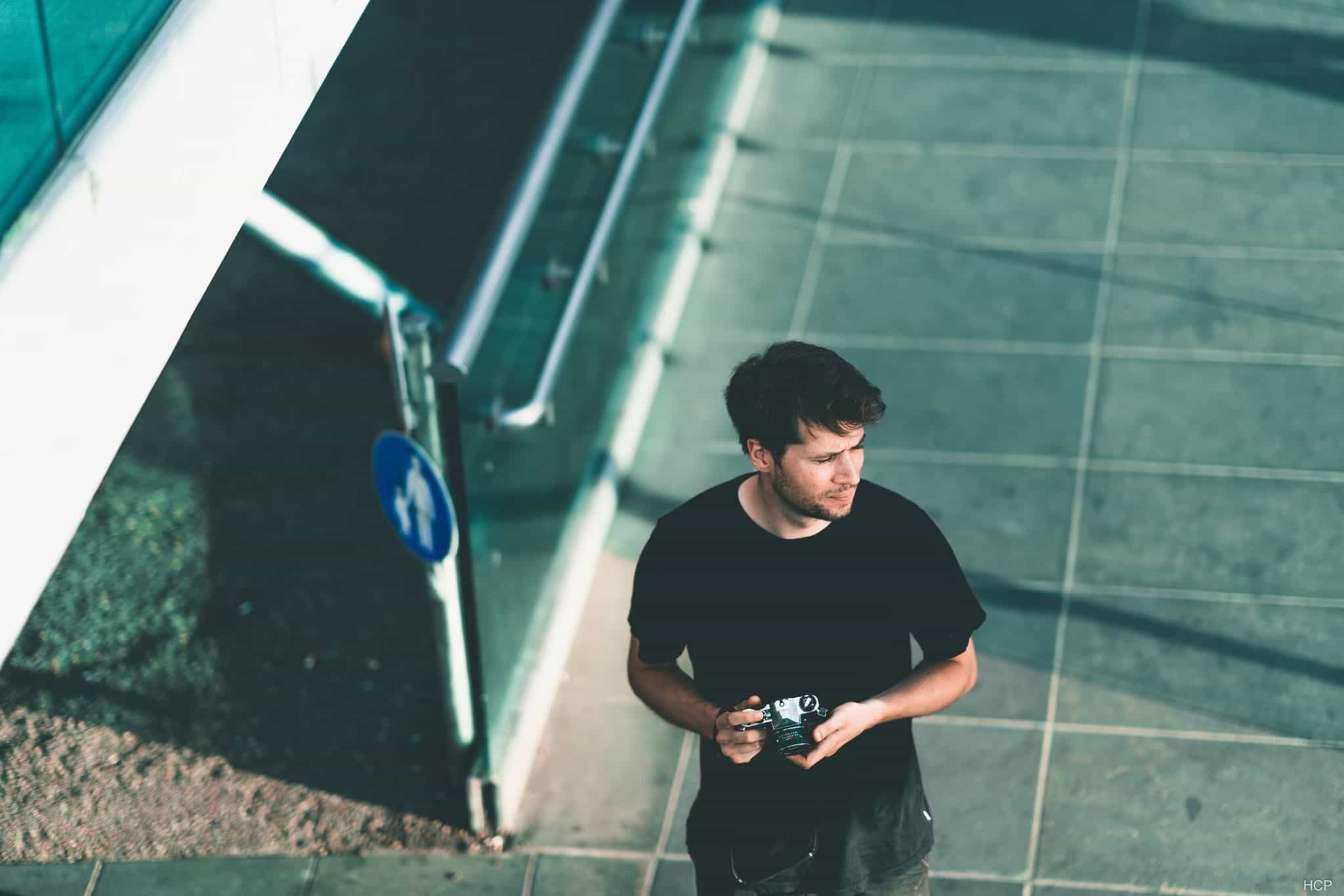 Robin Claude holding a camera